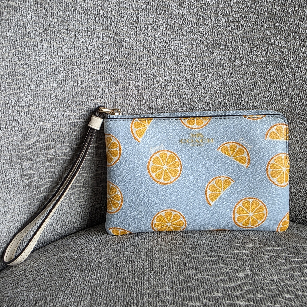 Beautiful COACH Light Blue Leather Wristlet Wallet With Orange Slice Print